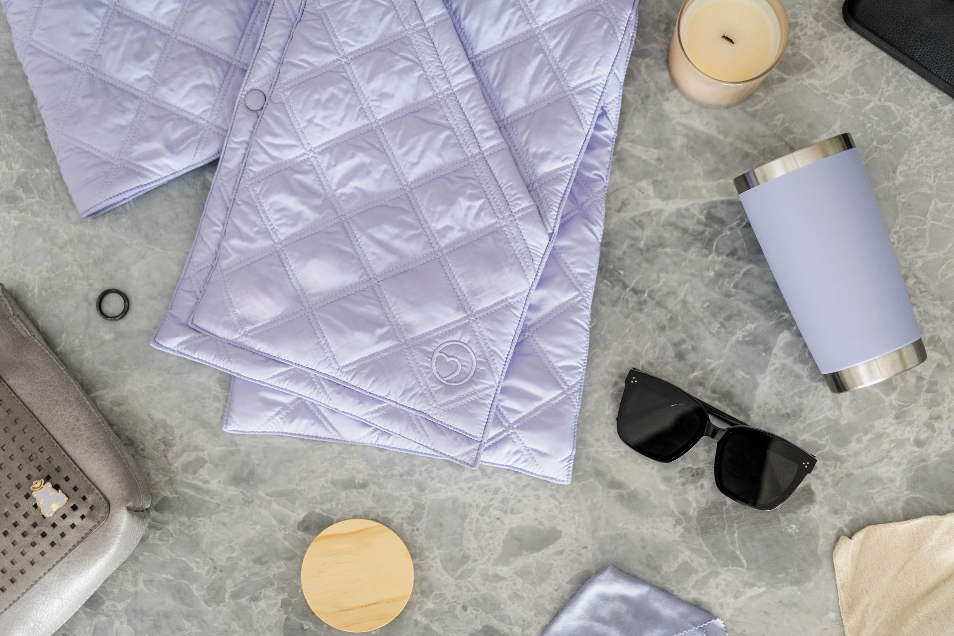 Lavender 418 Scarf laid flat with travel essentials